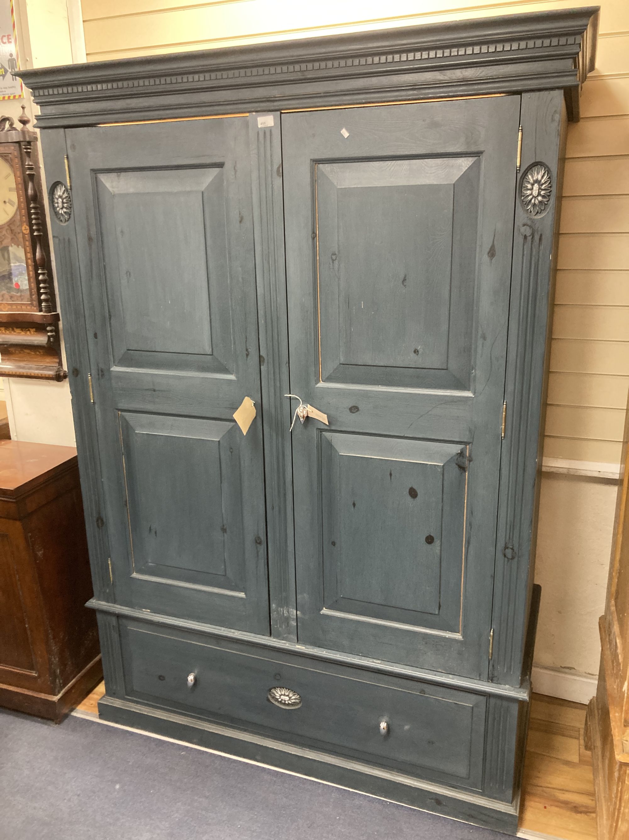A Victorian style blue painted panelled pine two door wardrobe, width 140cm depth 60cm height 198cm